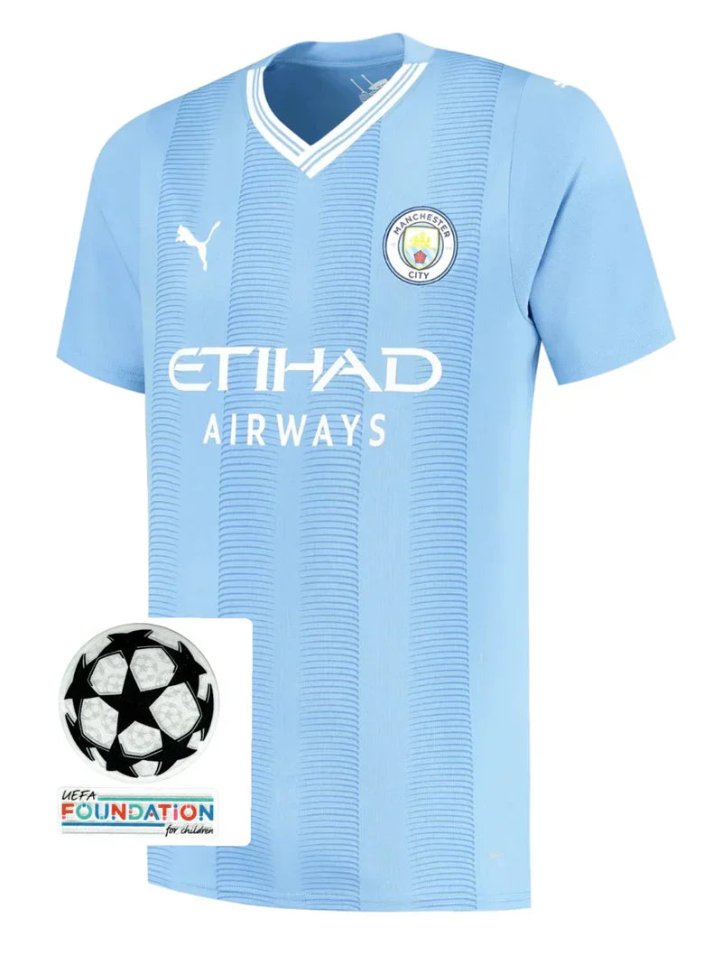 Camisola Manchester City I com PATCH 23/24 - Azul e Branca