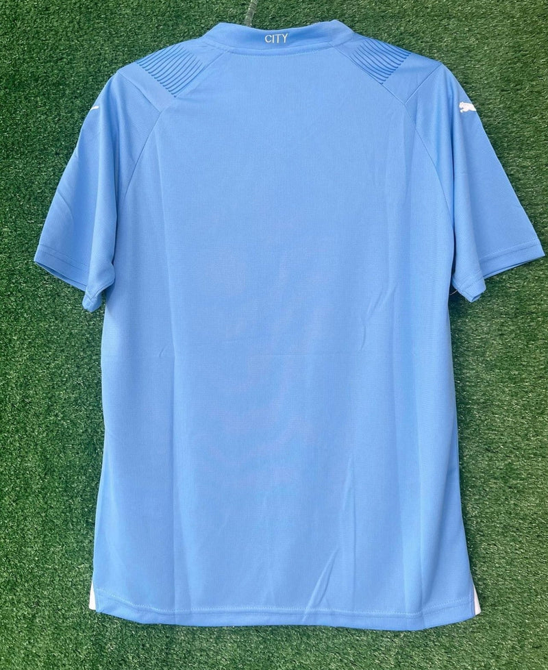 Camisola Manchester City I com PATCH 23/24 - Azul e Branca